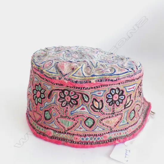 Indian? pink embroidered skull cap.